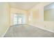 Bright, spacious bedroom with neutral carpet and sliding doors to the outside at 3034 Tiffany Ct, Carmel, IN 46033