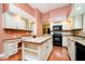 Spacious kitchen with ample cabinet space, an island with a tile countertop, and modern appliances at 3034 Tiffany Ct, Carmel, IN 46033