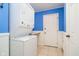 Cozy laundry room features a stackable washer and dryer with an adjacent utility sink at 3034 Tiffany Ct, Carmel, IN 46033