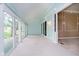 Bright sunroom with multiple windows and glass doors providing ample natural light and access to the outdoors at 3034 Tiffany Ct, Carmel, IN 46033