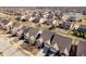An aerial view of a neighborhood with well-maintained lawns and a serene pond at 3509 Heathcliff Ct, Westfield, IN 46074