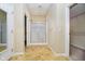 En-suite bathroom featuring a separate shower and large mirror at 3509 Heathcliff Ct, Westfield, IN 46074
