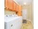 Convenient laundry room with washer, dryer, and storage cabinets at 3509 Heathcliff Ct, Westfield, IN 46074