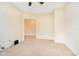 Spacious living room with neutral walls and carpet flooring, seamlessly connecting to other areas of the home at 3509 Heathcliff Ct, Westfield, IN 46074