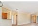Bright living space with neutral walls, carpet flooring, and an open view to the kitchen area at 3509 Heathcliff Ct, Westfield, IN 46074