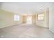 Open-concept living area with neutral walls, carpet flooring, and an open view into the dining area at 3509 Heathcliff Ct, Westfield, IN 46074