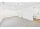 Spacious basement with carpet flooring, fresh paint, and ample room for storage or recreation at 3918 Columbus Ave, Anderson, IN 46013