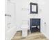 Bathroom featuring white walls, modern vanity, and shower with updated fixtures at 3918 Columbus Ave, Anderson, IN 46013