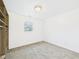 Clean bedroom with a closet to the left and a window in the center at 3918 Columbus Ave, Anderson, IN 46013