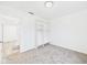 Bedroom with gray carpet and a closet featuring white shelves at 3918 Columbus Ave, Anderson, IN 46013