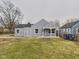 Charming single-story home with gray siding, a covered porch, and a well-maintained lawn at 3918 Columbus Ave, Anderson, IN 46013