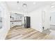 Bright, open kitchen and dining area with modern flooring and stainless steel appliances at 3918 Columbus Ave, Anderson, IN 46013