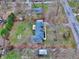 Expansive lot with lush green lawn and mature trees, perfect for outdoor activities and relaxation at 405 W 73Rd St, Indianapolis, IN 46260