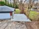 Aerial view of backyard with a gravel parking area and a detached garage at 405 W 73Rd St, Indianapolis, IN 46260