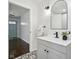 Well-lit bathroom with a modern vanity, black fixtures, and stylish patterned tile floors at 405 W 73Rd St, Indianapolis, IN 46260