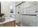 This bathroom features a new sink and a marble-look glass shower at 405 W 73Rd St, Indianapolis, IN 46260