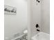 Clean, well-lit bathroom with neutral decor features a modern shower and patterned tile floors at 405 W 73Rd St, Indianapolis, IN 46260