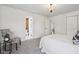 This bedroom features neutral carpet, white walls, and two doorways at 405 W 73Rd St, Indianapolis, IN 46260