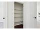A walk-in closet with hardwood floor and built in shelving at 405 W 73Rd St, Indianapolis, IN 46260