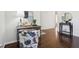 An inviting entryway with wood floors and stylish decor featuring a wooden desk and front door at 405 W 73Rd St, Indianapolis, IN 46260