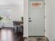 An inviting entryway with wood floors and stylish decor featuring a modern front door at 405 W 73Rd St, Indianapolis, IN 46260