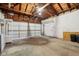 Spacious garage with a garage door and a bright overhead light at 405 W 73Rd St, Indianapolis, IN 46260