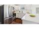 Updated kitchen with stainless steel appliances, white cabinets and bright interior at 405 W 73Rd St, Indianapolis, IN 46260