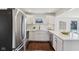 Modern kitchen featuring stainless steel appliances, white cabinets, and quartz countertops at 405 W 73Rd St, Indianapolis, IN 46260