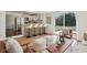 Open-concept living room flows into a modern kitchen and features access to the back deck at 405 W 73Rd St, Indianapolis, IN 46260