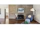 Inviting living room with stone fireplace, hardwood floors, and comfortable seating arrangement at 405 W 73Rd St, Indianapolis, IN 46260