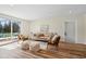 Bright living room with hardwood floors, modern furnishings, and access to the outdoor space at 405 W 73Rd St, Indianapolis, IN 46260