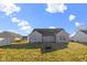 Spacious backyard featuring a grass lawn and a house with siding at 4062 S Meadow Wood Ct, New Palestine, IN 46163