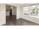 The bright dining room with large windows, transitions into the kitchen area at 4062 S Meadow Wood Ct, New Palestine, IN 46163