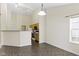 Open-concept dining and kitchen area with natural light and modern fixtures for comfort and style at 4062 S Meadow Wood Ct, New Palestine, IN 46163