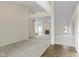 Bright, open-concept living space with neutral carpet, fireplace, and seamless flow between rooms at 4062 S Meadow Wood Ct, New Palestine, IN 46163
