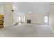 Large living room with a cozy fireplace, an open floor plan, carpet, and a seamless transition to other areas at 4062 S Meadow Wood Ct, New Palestine, IN 46163