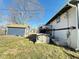 Home's backyard featuring a deck and a partially fenced-in yard at 4144 Richelieu Rd, Indianapolis, IN 46226
