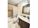 Bathroom with tiled shower, vanity, and fixtures at 4144 Richelieu Rd, Indianapolis, IN 46226