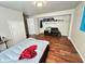 Bedroom featuring hardwood floors, an open closet, and neutral paint at 4144 Richelieu Rd, Indianapolis, IN 46226