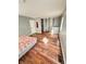 Bedroom with hardwood floors, closet, and light grey walls at 4144 Richelieu Rd, Indianapolis, IN 46226