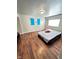 Spacious bedroom featuring hardwood floors and a window for natural light at 4144 Richelieu Rd, Indianapolis, IN 46226
