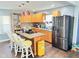 Kitchen features light-colored cabinets, granite countertops, and stainless steel appliances at 4144 Richelieu Rd, Indianapolis, IN 46226