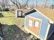 Two sheds in a grassy, fenced yard, adding storage to the property at 4144 Richelieu Rd, Indianapolis, IN 46226