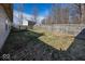 Large backyard enclosed by a wooden fence, offering ample space for outdoor activities and privacy at 4238 Vestry Ct, Indianapolis, IN 46237