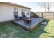 Cozy backyard deck with furniture, adjacent to the house and fenced yard, perfect for outdoor relaxation at 4238 Vestry Ct, Indianapolis, IN 46237