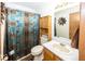 Well-maintained bathroom features a decorative mirror and cabinet above toilet at 4238 Vestry Ct, Indianapolis, IN 46237