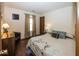 Inviting bedroom with comfortable bed, dark wood furniture, and cozy window nook at 4238 Vestry Ct, Indianapolis, IN 46237