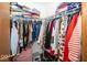 Walk-in closet filled with shelves and hanging rods and an assortment of clothing at 4238 Vestry Ct, Indianapolis, IN 46237