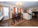 Cozy dining area features wood table and chairs, flowing into the connected living room at 4238 Vestry Ct, Indianapolis, IN 46237