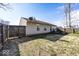 The home features a backyard with privacy fence and a deck area that is ideal for entertaining or relaxing at 4238 Vestry Ct, Indianapolis, IN 46237